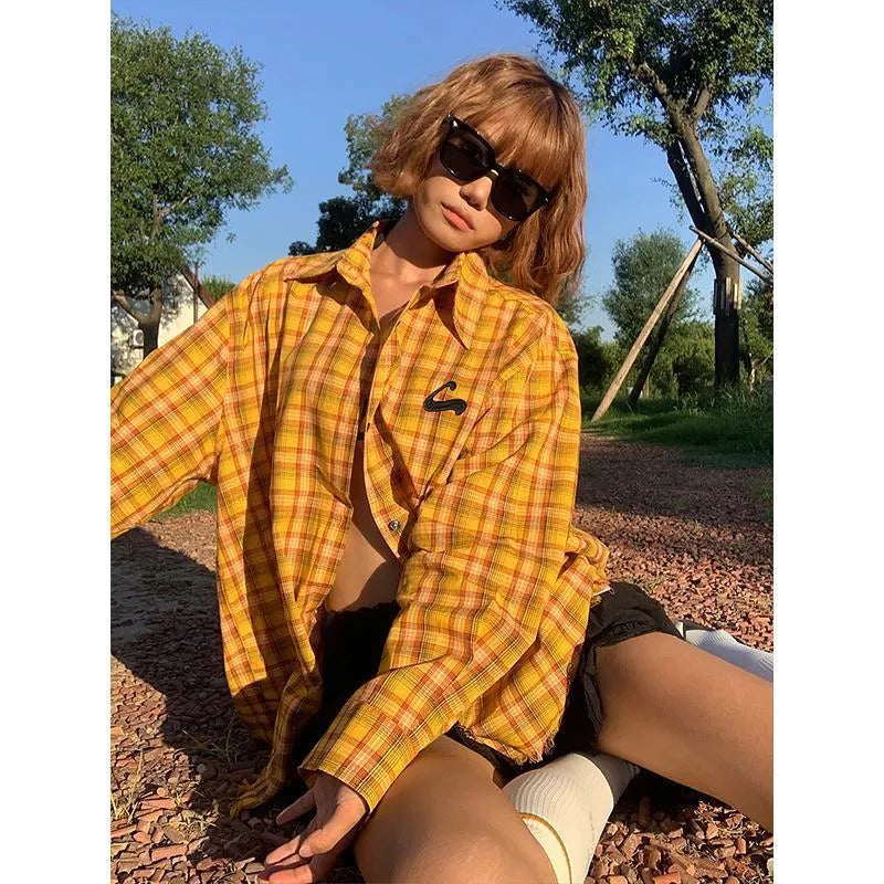 Man and woman modelling a loose-fit dopamine yellow plaid casual shirt.