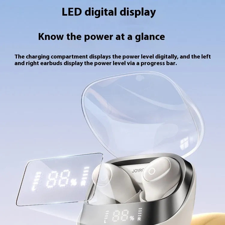 Wireless Bluetooth in-ear headphones with a compact white charging case on a table.