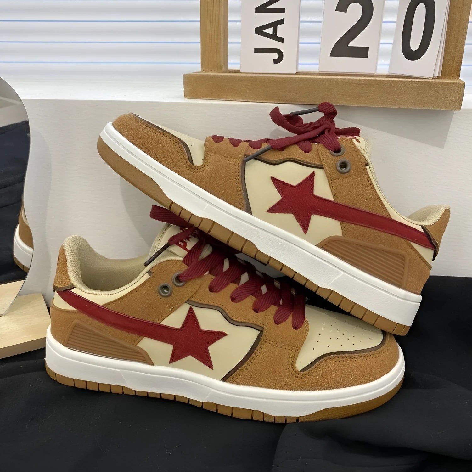 Brown women's platform sneakers with sequin details and a lace-up front.