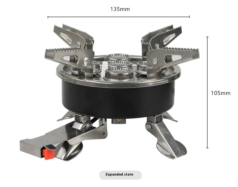 Silver foldable split camping stove with extended gas hose on a grey background