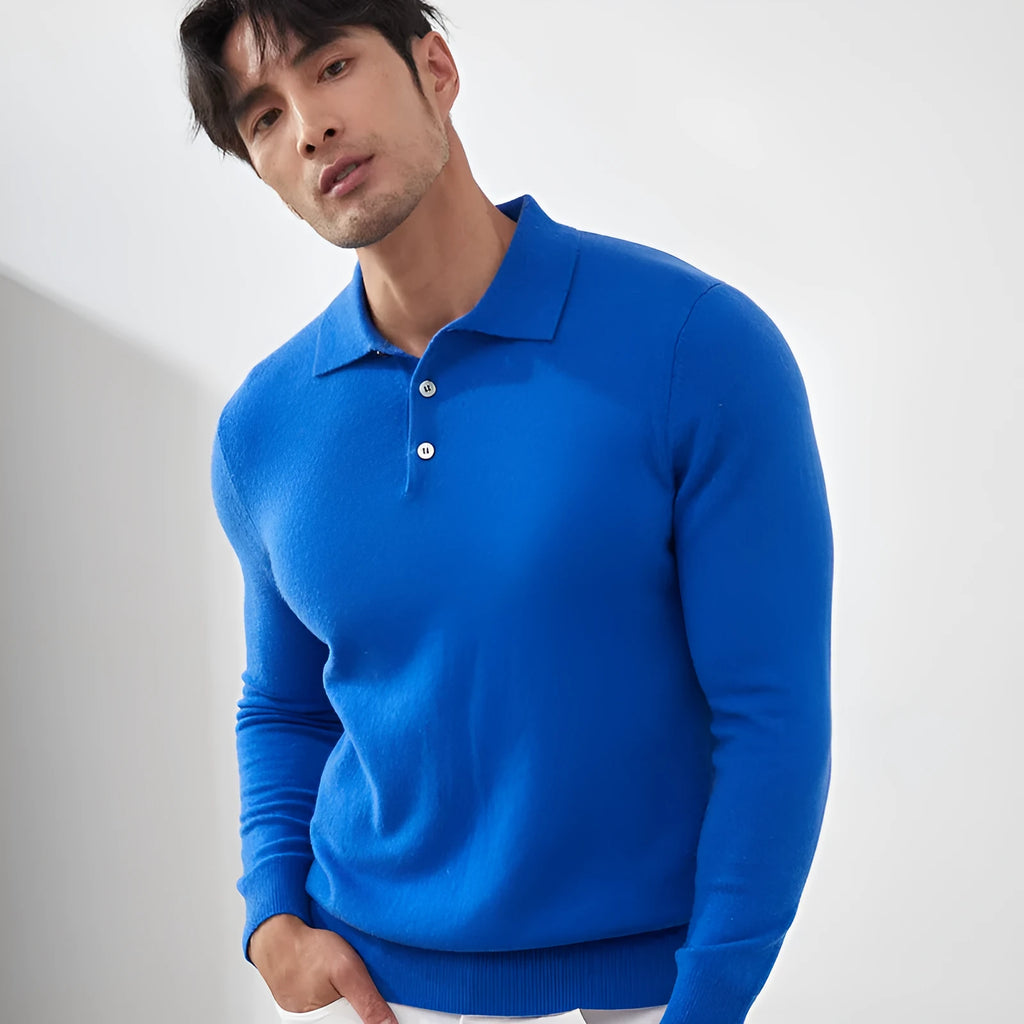 Man wearing a sapphire blue cashmere polo collar pullover sweater with a loose fit.