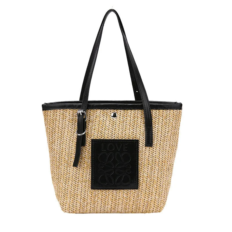 Straw woven women's shoulder bag in black with three-dimensional pocket and 27cm width