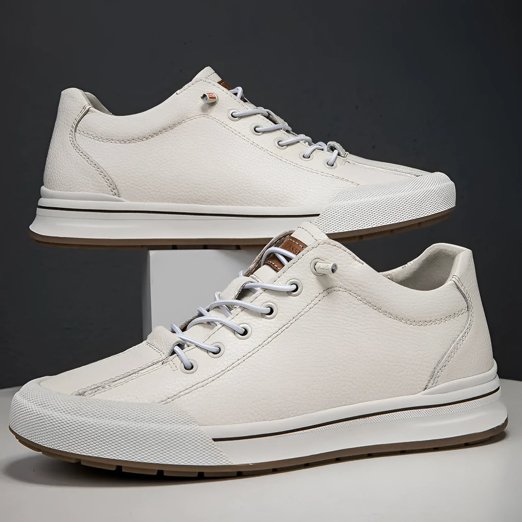 Men's white matte leather casual shoes with flat heel and round toe on a solid background.