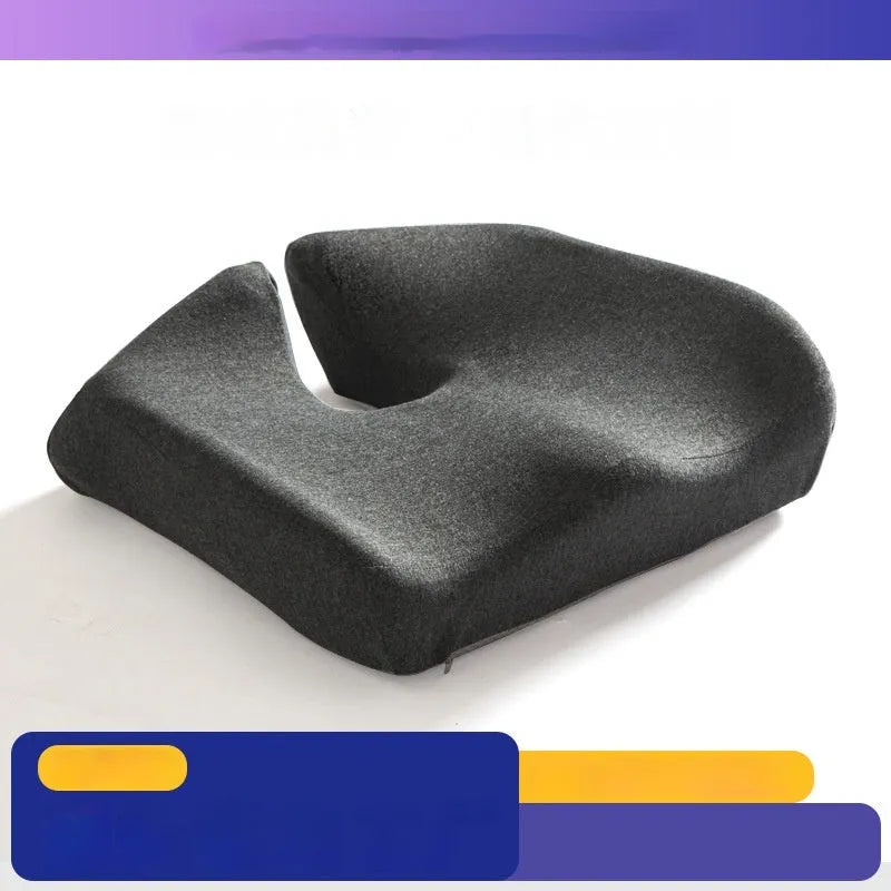 Dark grey memory foam office chair cushion with lumbar support, shown on a black desk chair.