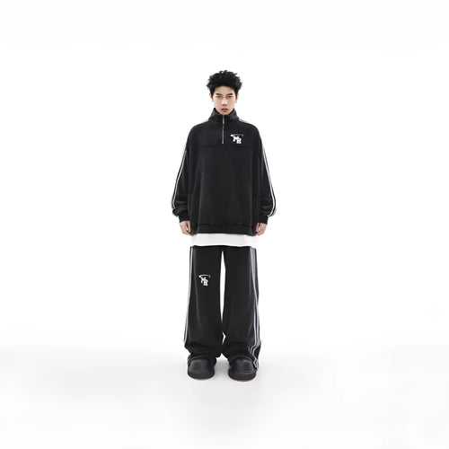 Black retro sports hoodie with a stand collar and long sleeves, shown on a model.
