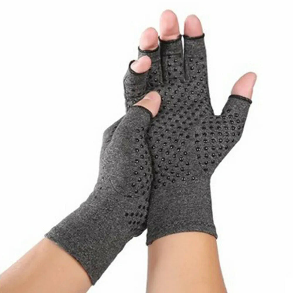 Grey fingerless compression glove with thumb hole, made from stretchy spandex fabric.
