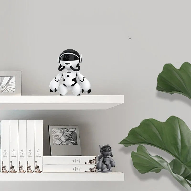 White wireless security camera on a stand, showing lens and compact design for home monitoring.