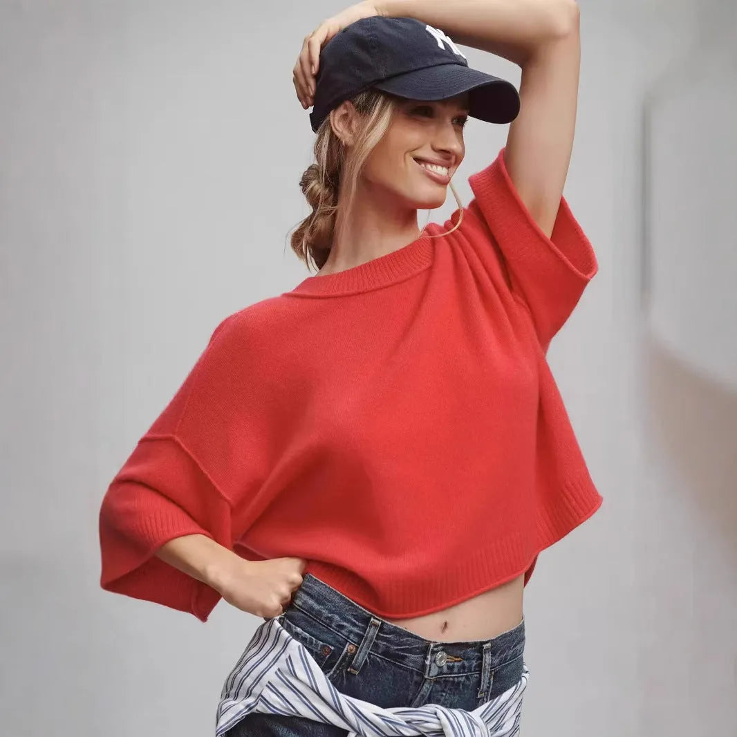 Red women's short viscose T-shirt with an exposed navel design on a model