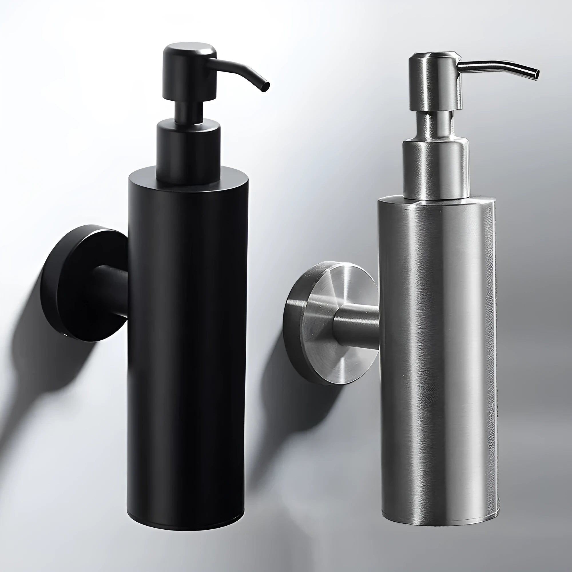 Stainless steel wall-mounted manual soap dispenser in brushed finish for commercial bathrooms