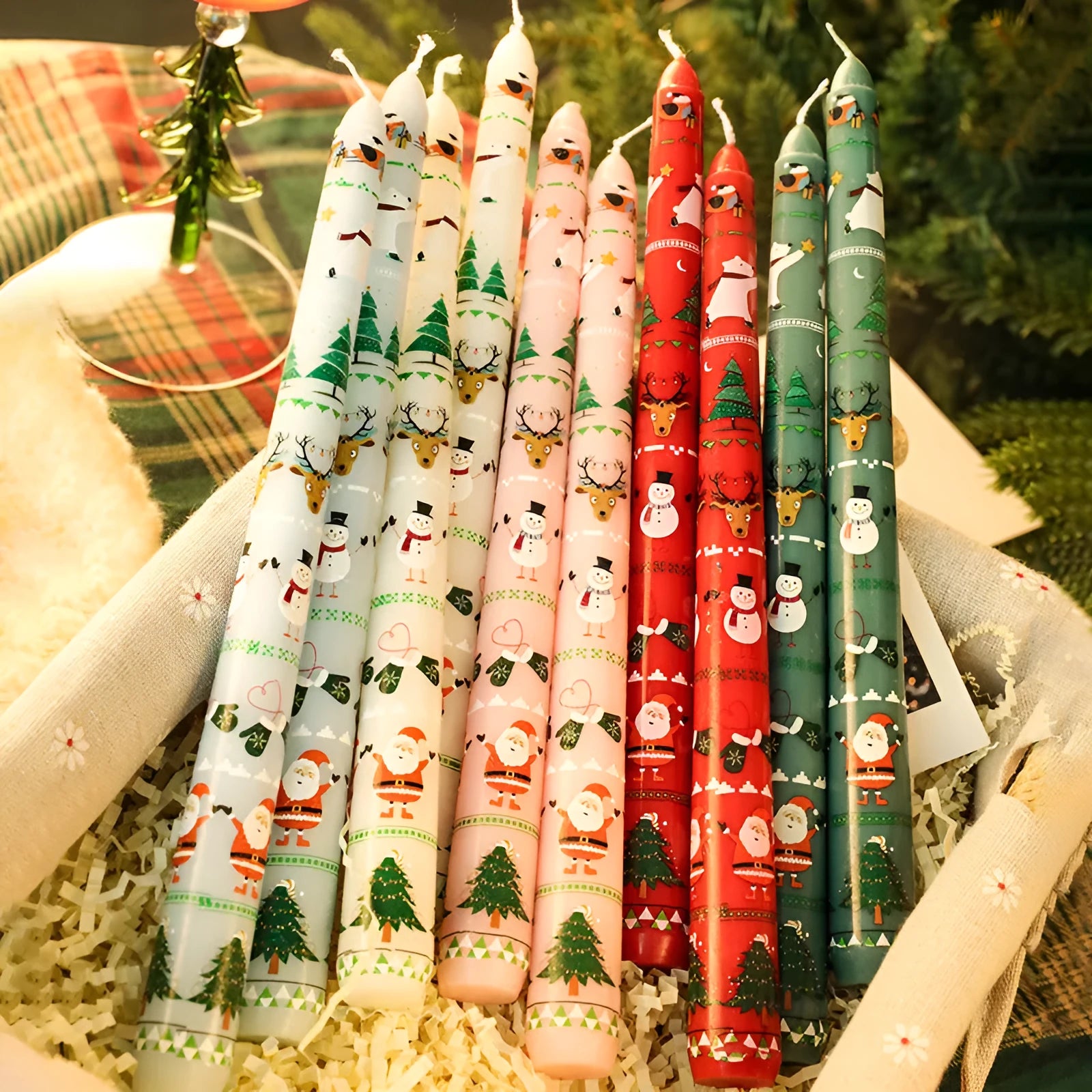 Christmas printed paraffin cylinder candle in bright red, 2.2x25cm, on a table