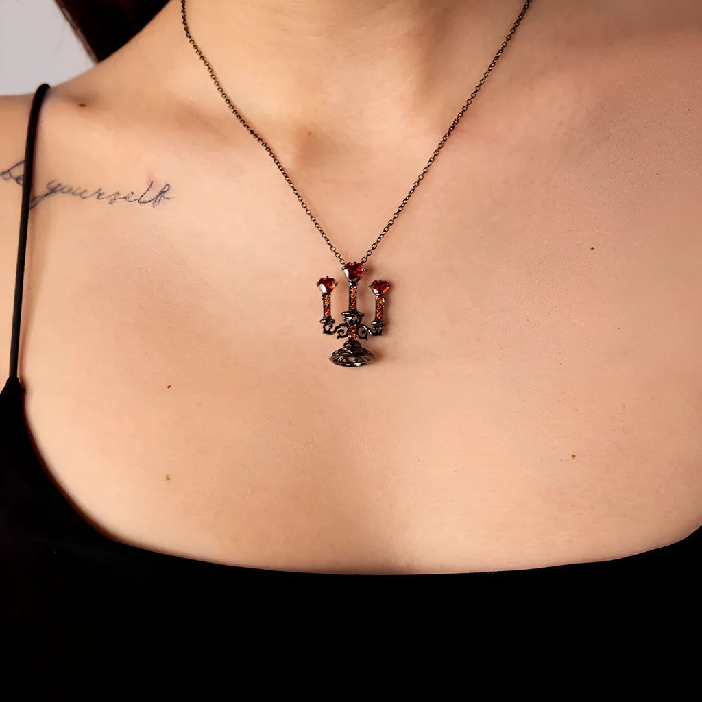 Gothic style zinc alloy clavicle chain necklace with a hollow candlestick pendant on a cross chain.