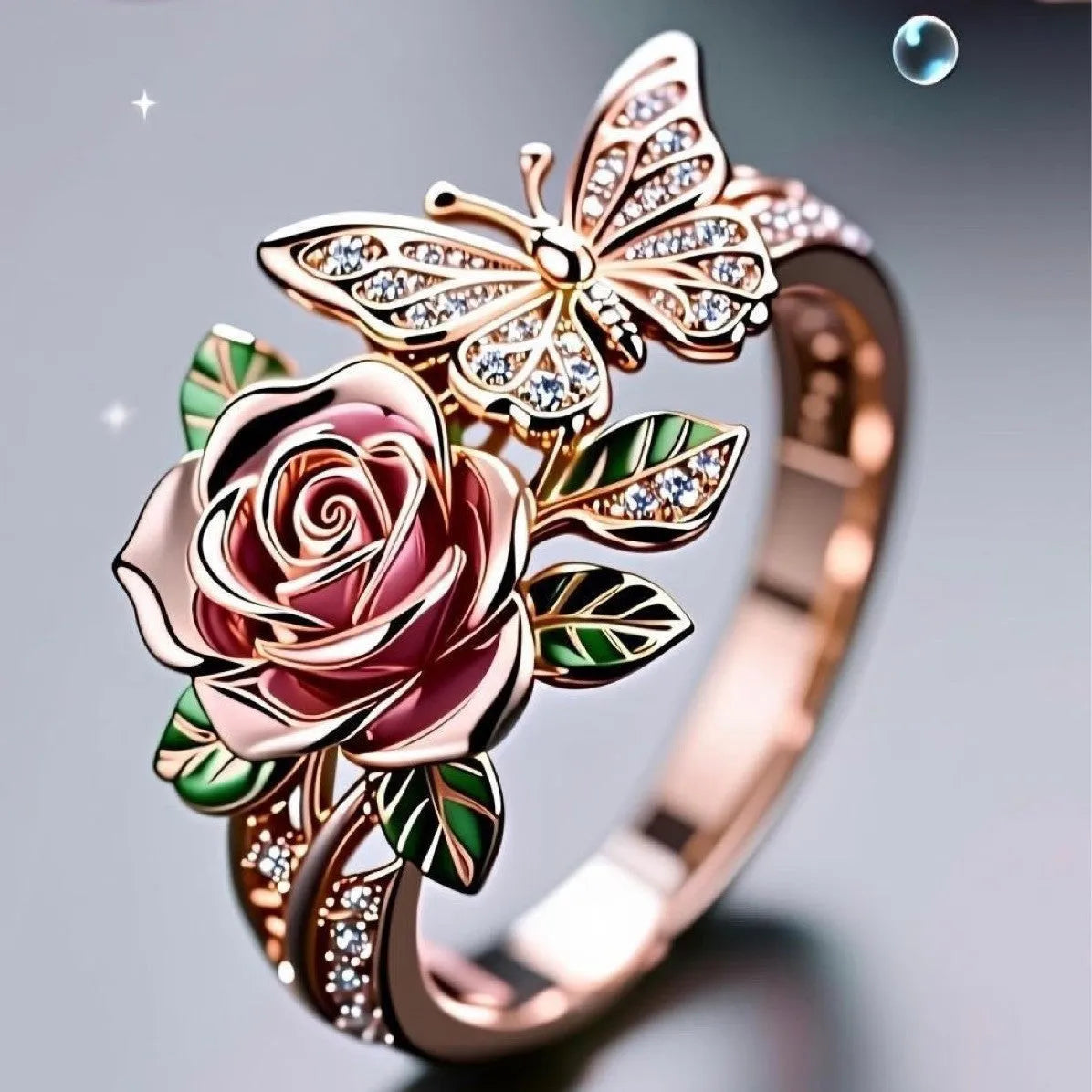Close-up of an adjustable fairy style ring with a colourful oil-drip butterfly, rose, and leaf design in alloy.