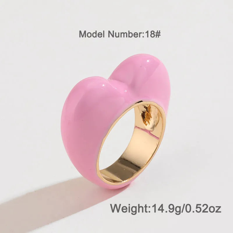 Colourful three-dimensional enamel heart ring on a zinc alloy band.