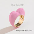 Colourful three-dimensional enamel heart ring on a zinc alloy band.