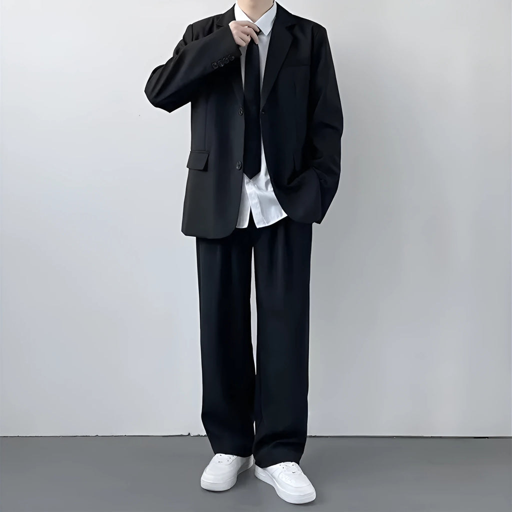Men's plus size college style suit set in grey, featuring a blazer, trousers, white shirt, and tie.