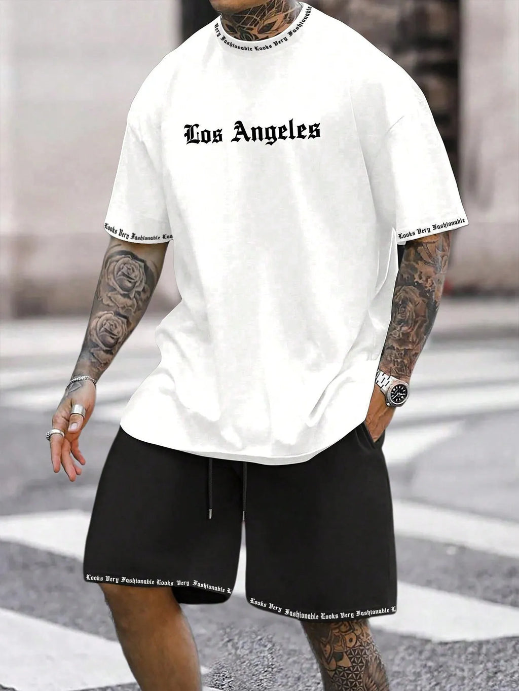 Sports style short-sleeved top and matching shorts set laid flat, showing thin polyester blend fabric.