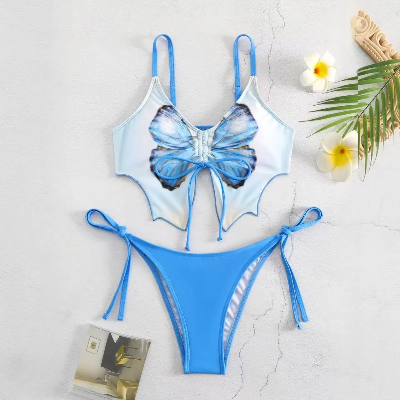 Women's purple bikini suit with bow ins style detail on a split design, made from polyester fabric.