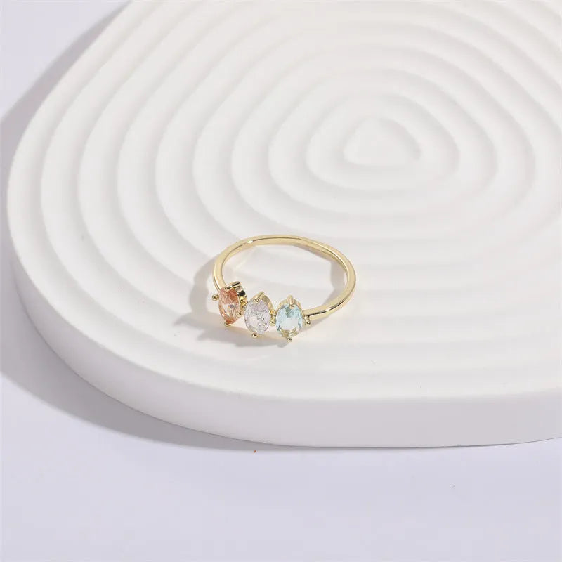 Geometric triangle ring with horse eye tricolor zircon in electroplated 14k gold colour on copper