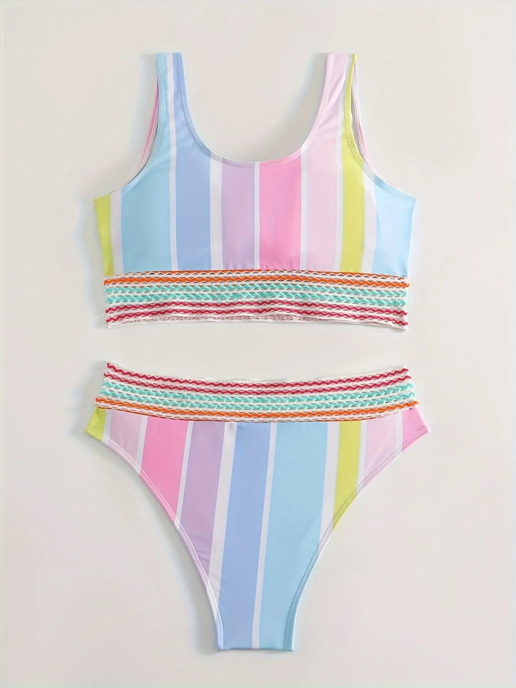 Women's striped two-piece bikini set for swimming and sports on a neutral background.