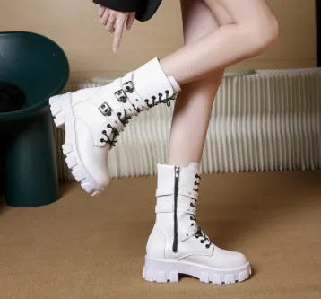 Black women's mid-calf buckle boots with side zip and round toe on a white background.