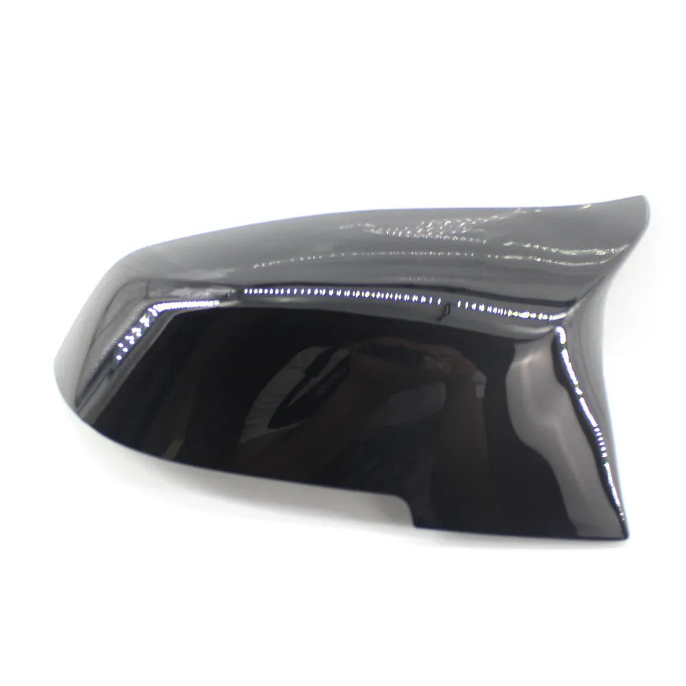Pair of dark bright black BMW horn-style rear-view mirror replacement shells.
