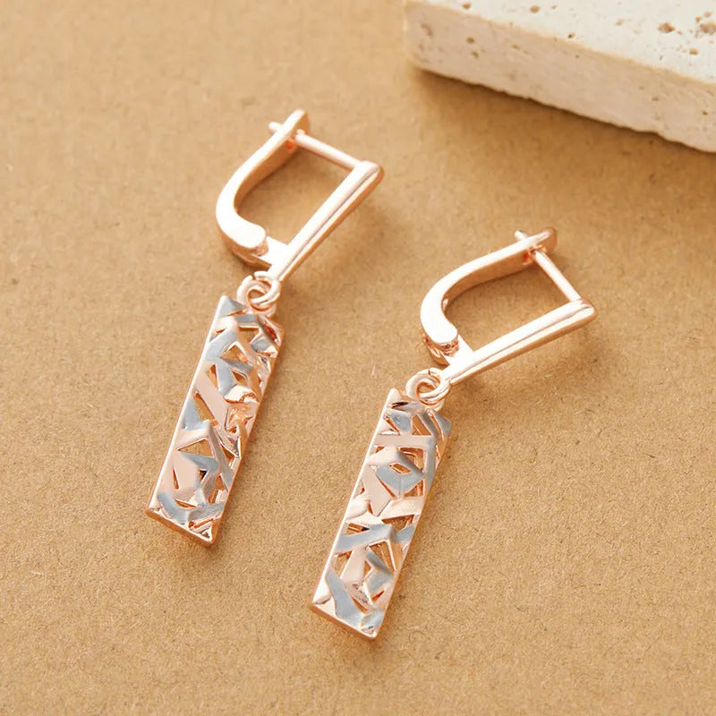 Rectangular hollow stud earrings with a two-tone colour geometric design