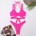 Women's solid colour strap bikini swimsuit in brief style on a hanger.