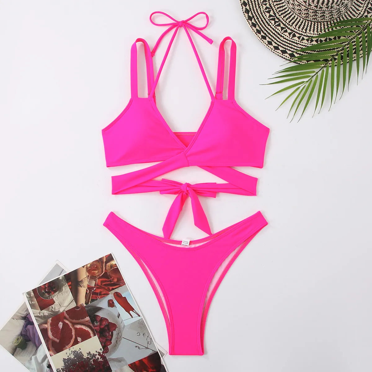 Women's solid colour strap bikini swimsuit in brief style on a hanger.