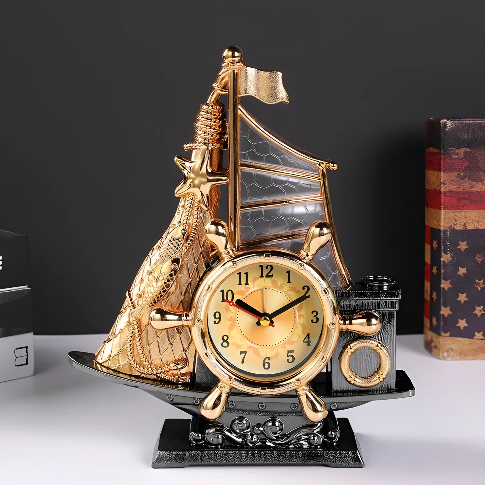 Gold or silver fashion bedroom alarm clock with plastic construction on wooden desk