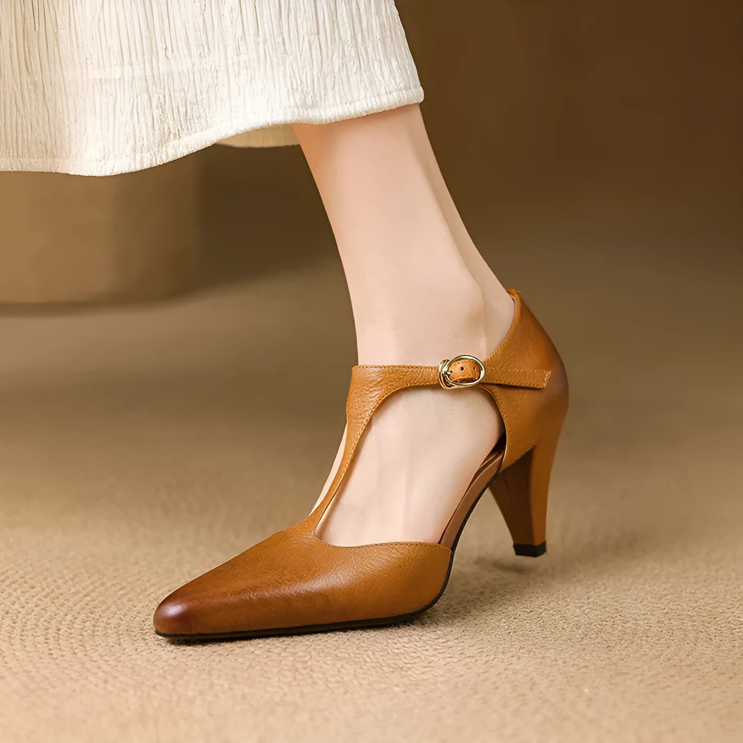 Brown retro women's T-strap sandals with a buckle and chunky heel on a white background.