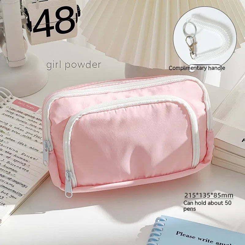 Double layer pencil case in blue, pink, green or cream with gift handle and 215x135x85mm dimensions