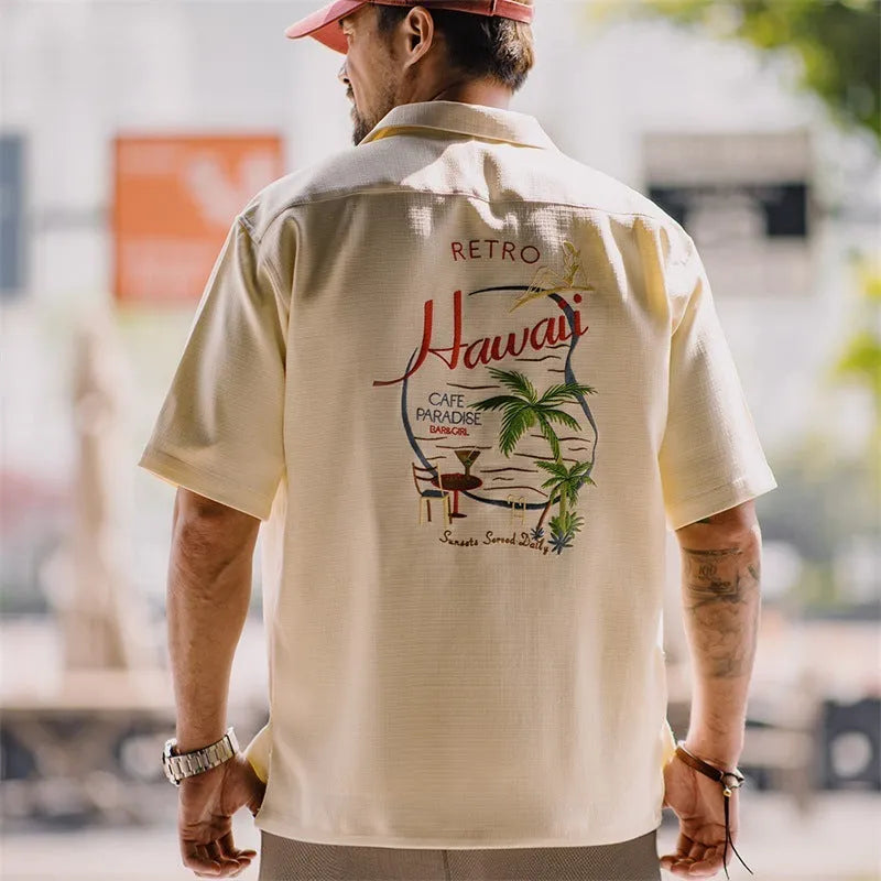 Light apricot men's Cuban collar shirt with bamboo plant pattern and short sleeves