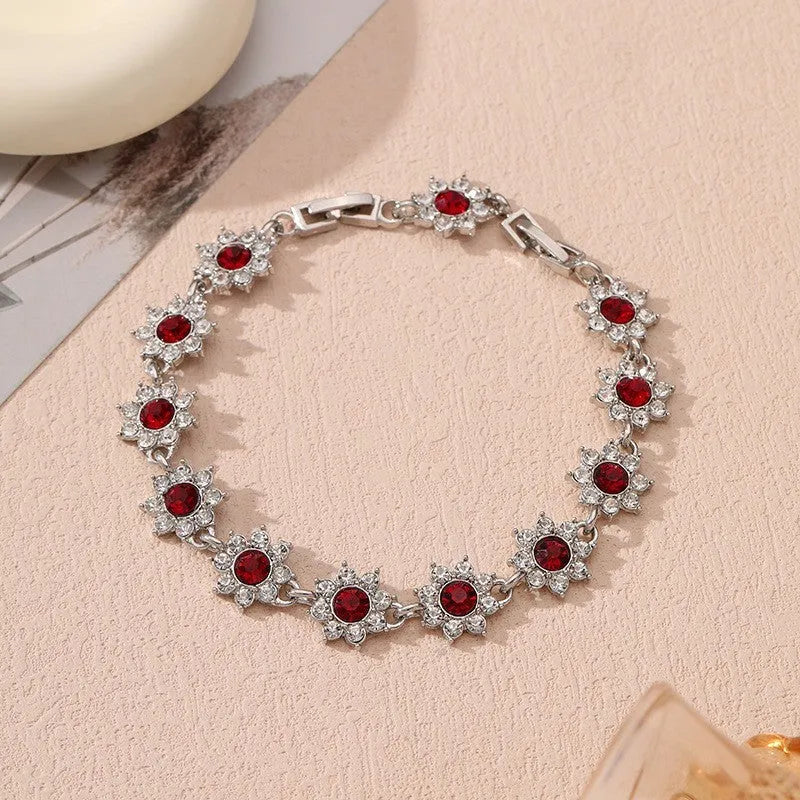 Flower design fashion bracelet in zinc alloy showing electroplated colour options with crystal and simulated diamond elements