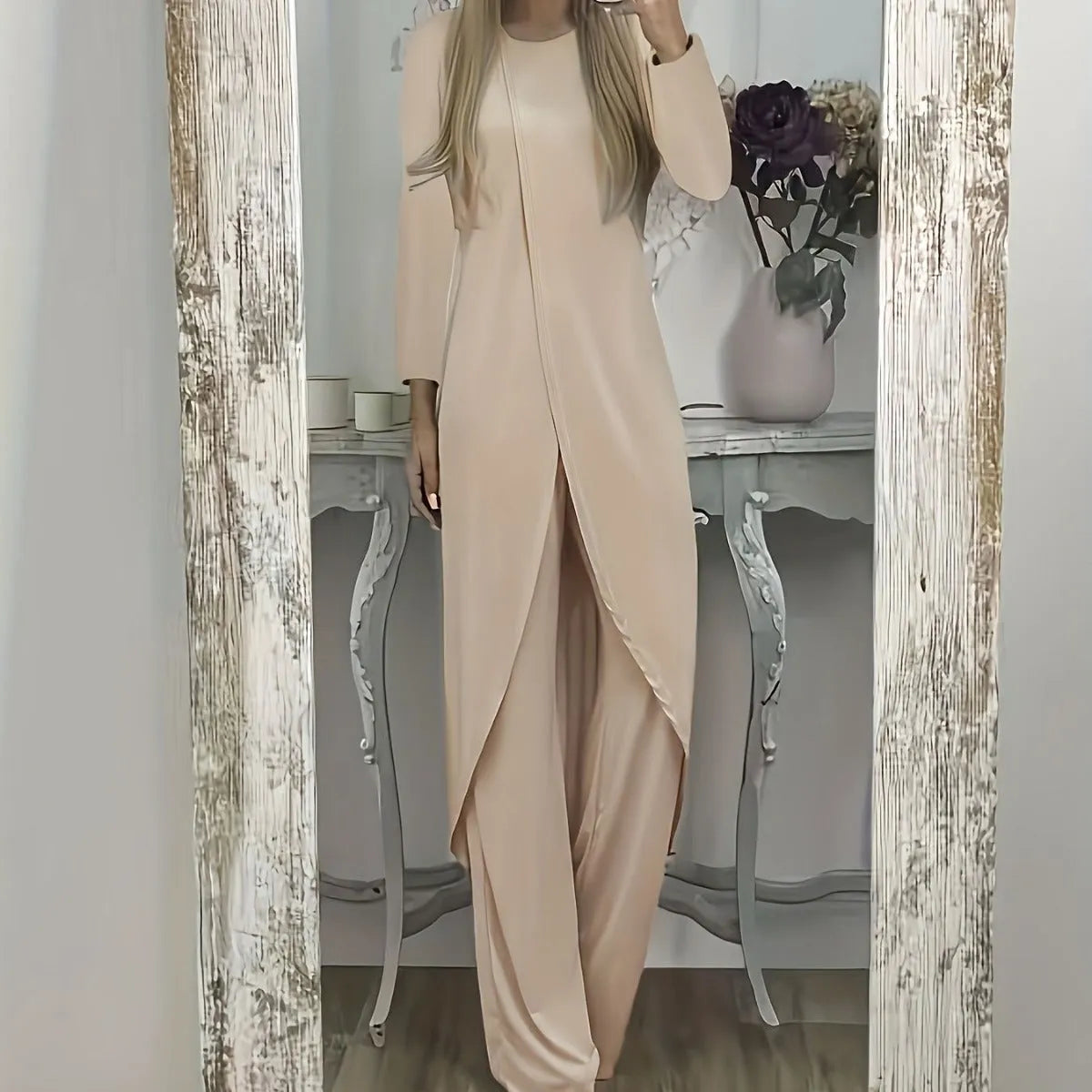Casual long sleeve polyester two-piece lounge set in black, shown with loose round neck top and trousers.
