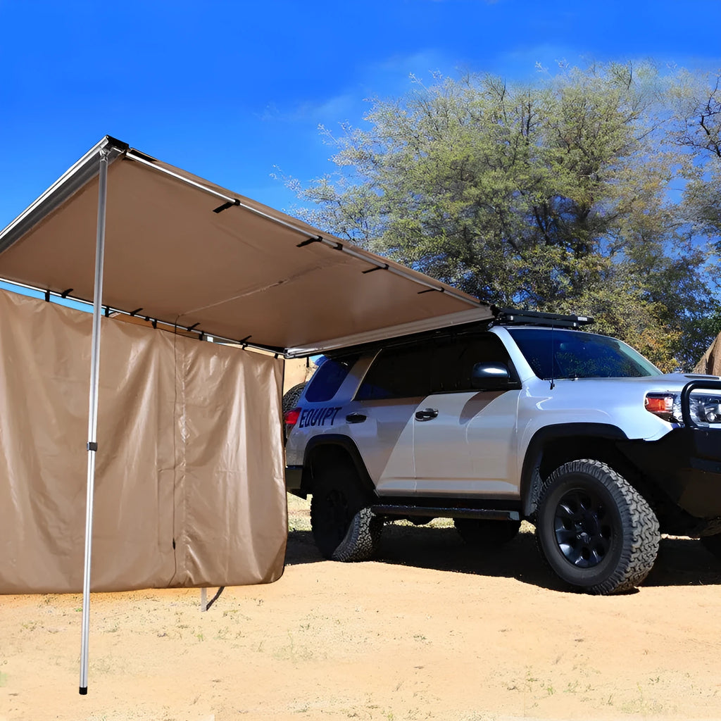 Black rainproof camping tent with aluminium poles set up outdoors, showing two-bedroom interior and Oxford cloth base.
