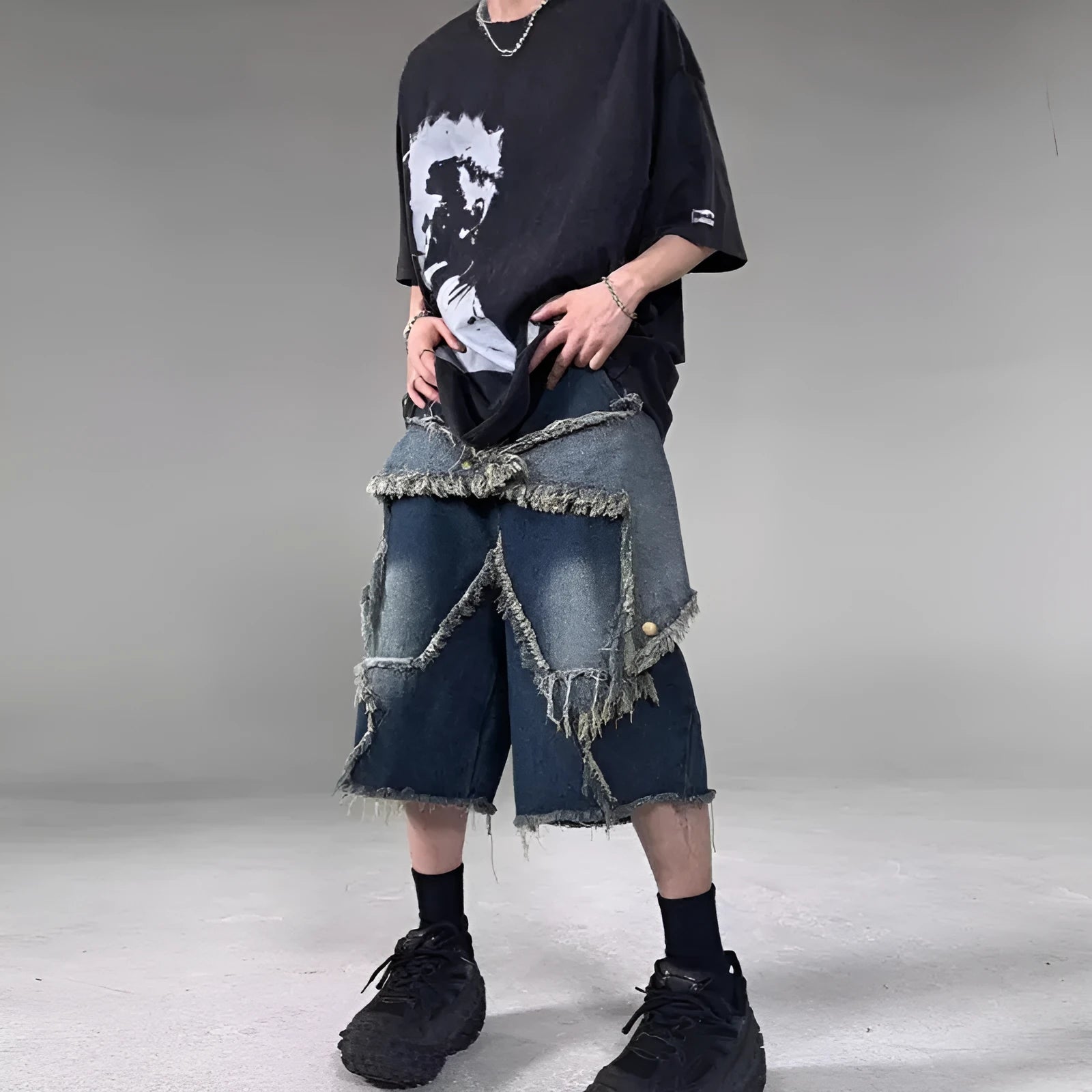 Blue denim shorts with frayed five-pointed star design in loose retro style