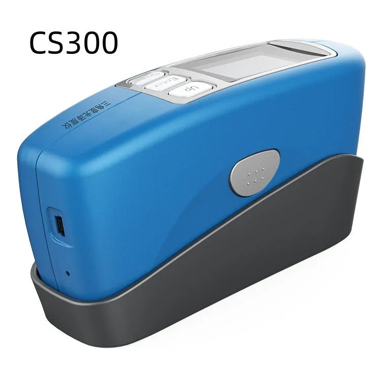 Handheld ceramic brightness stone portable glossiness tester gloss meter on a work surface.