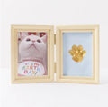 Solid wood cat palm print photo frame with gold lacquer and seal paste kit on table