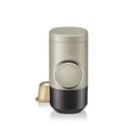Olive gray manual espresso portable capsule coffee machine with storage bag and accessories on outdoor table
