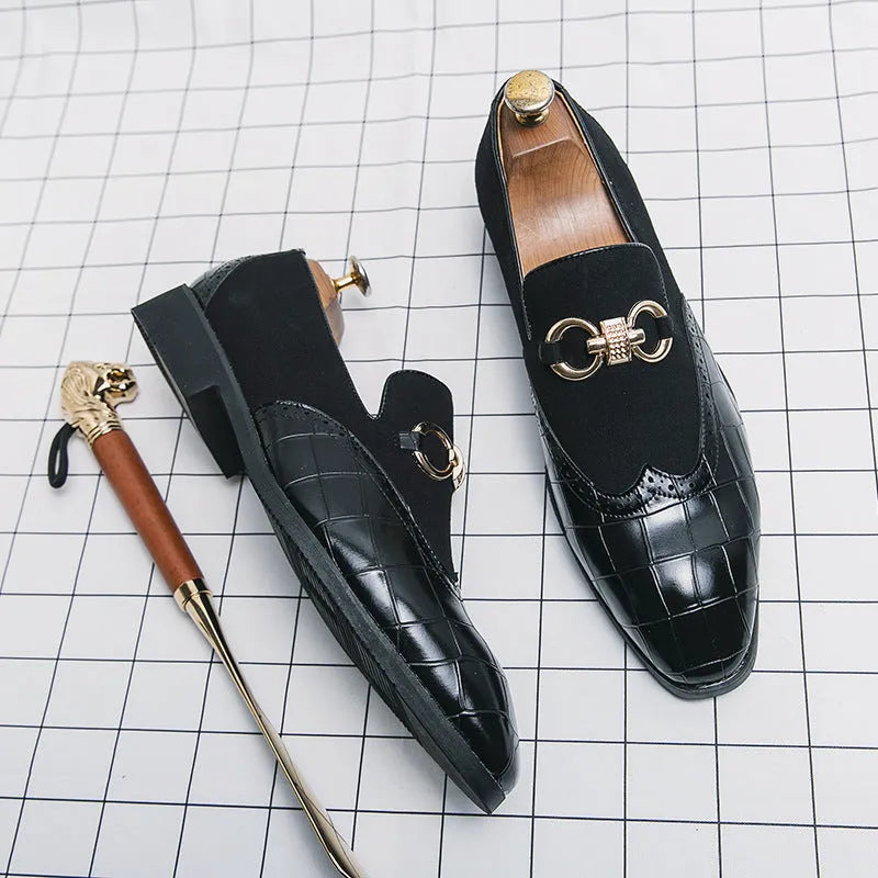 Men's black pointed toe low top casual shoes with a rubber sole and decorative stitching.