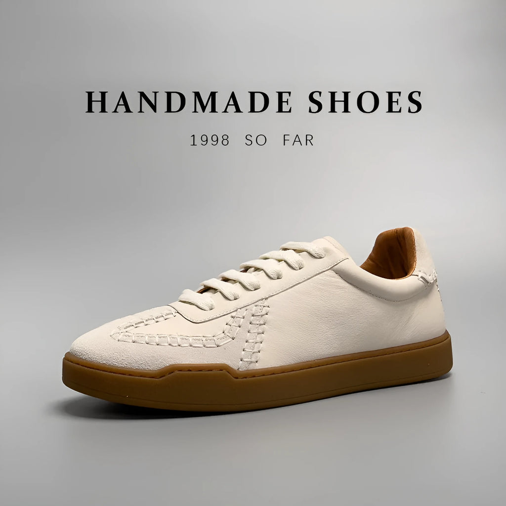 Men's beige genuine leather low-cut sneakers with white lace-up front and rubber sole on neutral background
