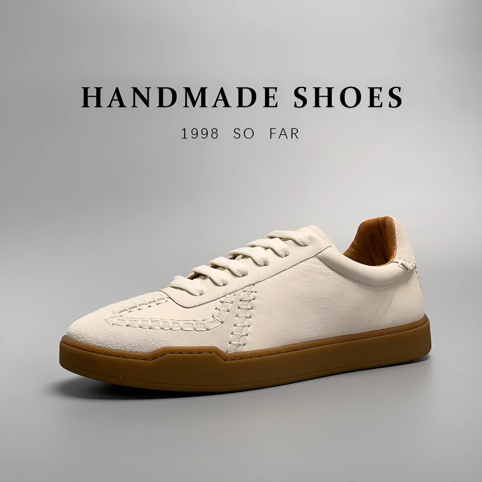 Men's beige genuine leather low-cut sneakers with white lace-up front and rubber sole on neutral background