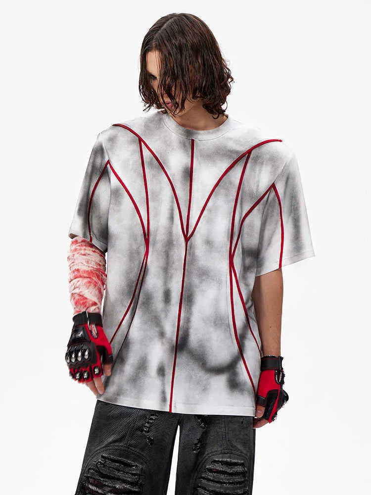 Padded shoulder short sleeve T-shirt with textured line patchwork detailing on round neck