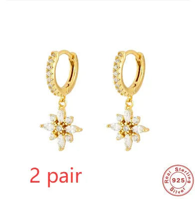 Sterling silver snowflake pendant earrings with diamond accents in white gold or yellow gold colour finish.
