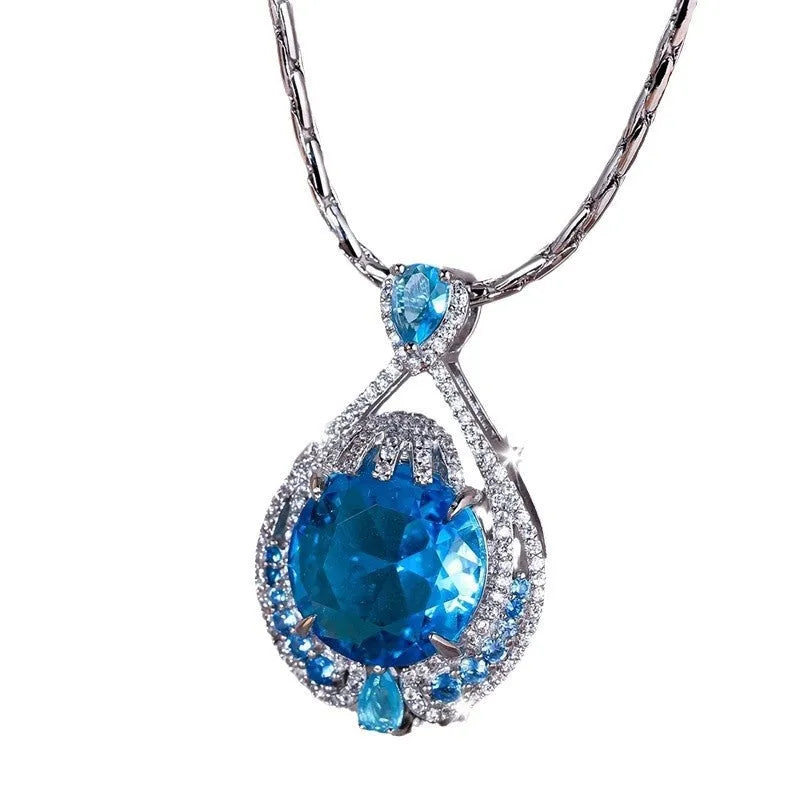 Geometric women's necklace with blue crystal pendant on water wave chain