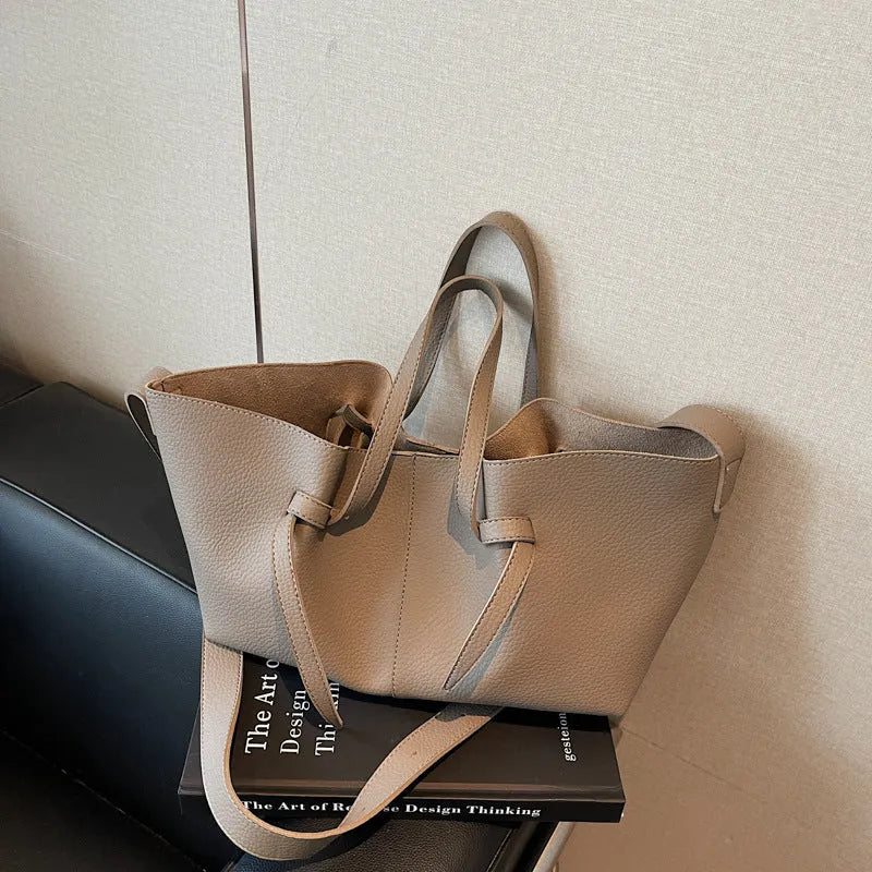 Large capacity one-shoulder crossbody bag in soft PU with sewing line detail, available in black, brown, coffee, gray