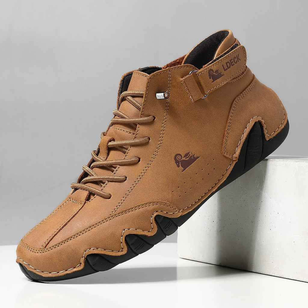 Men's khaki high top Octopus shoes with a round toe and rubber sole on a neutral background.