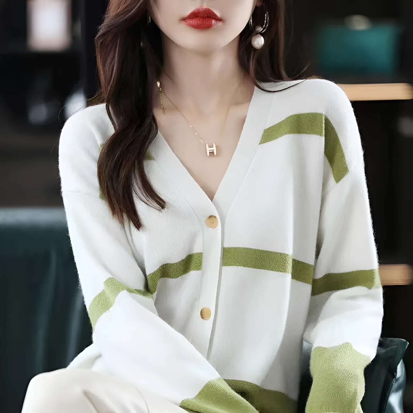 Women's slim fit V-neck cardigan with 3D striped pattern in black and white.