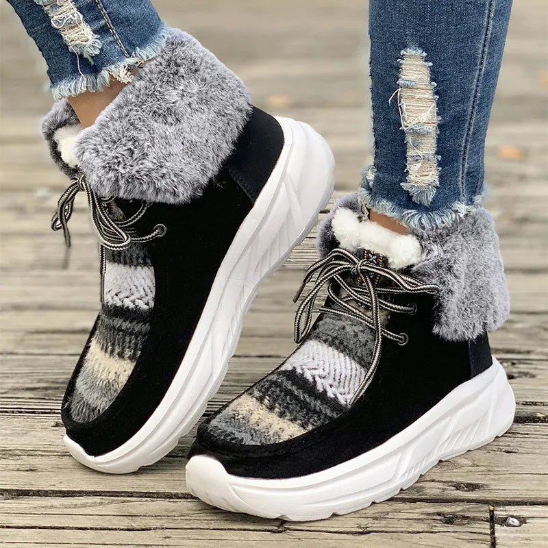 Women's beige lace-up snow boots with suede upper, thick rubber sole, and fuzzy lining on a white background.