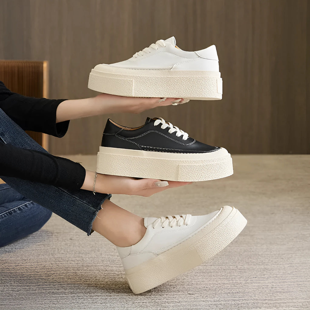 Women's black platform sports shoes with embossed cowhide leather upper and rubber sole